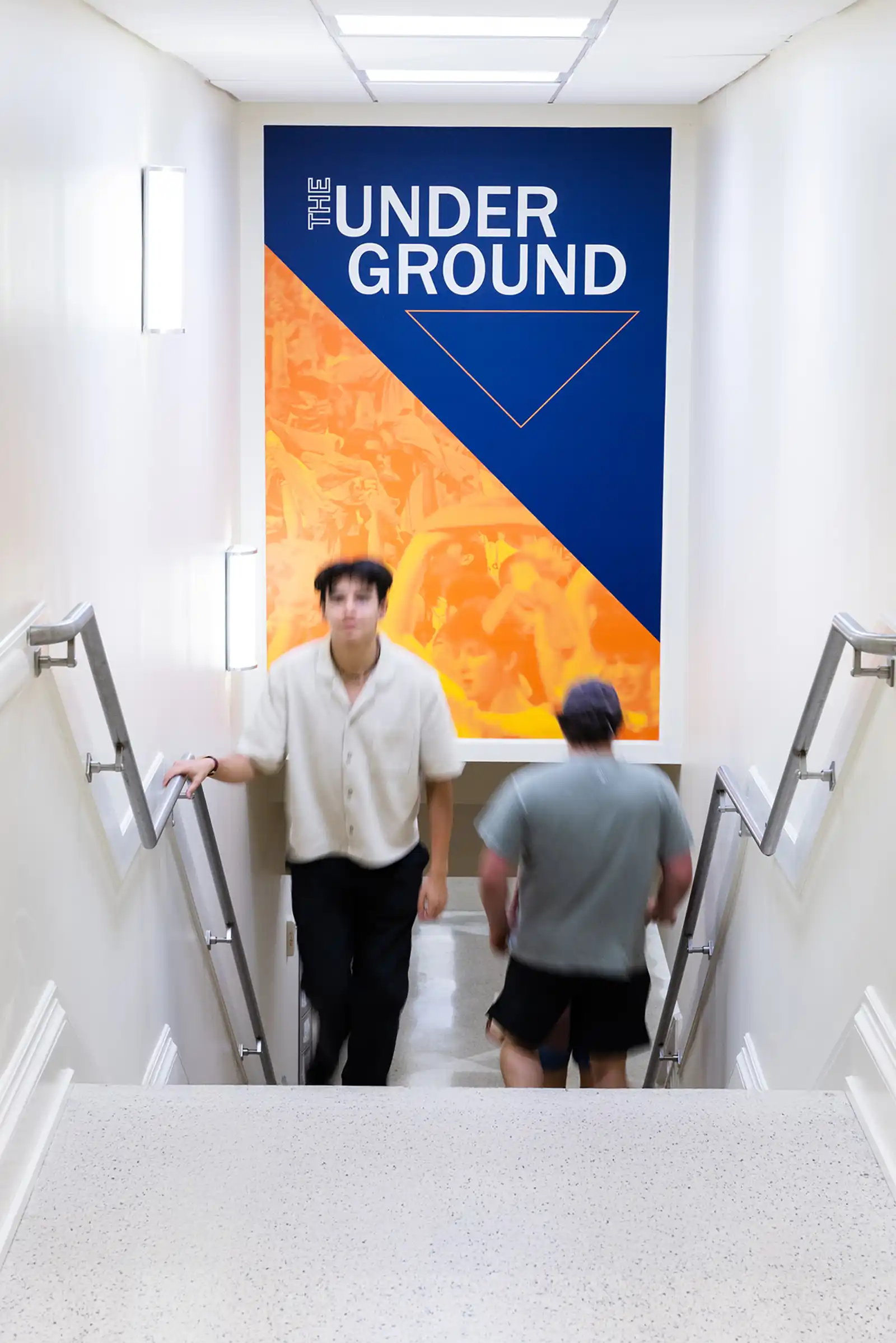 Stairway wall graphics for "The Under Ground" at Newcomb Hall