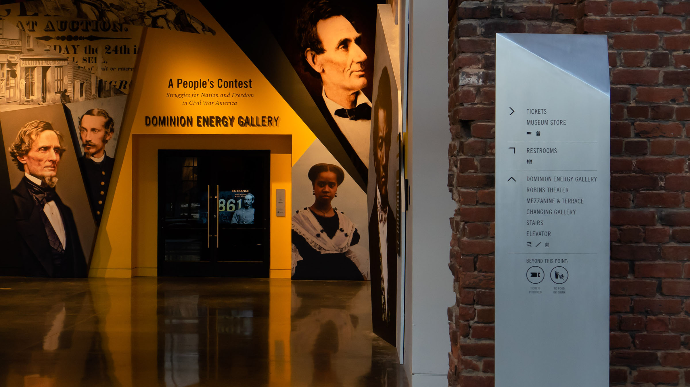 American Civil War Museum interior with exhibit graphics to the left and a Wayfinding sign to the right