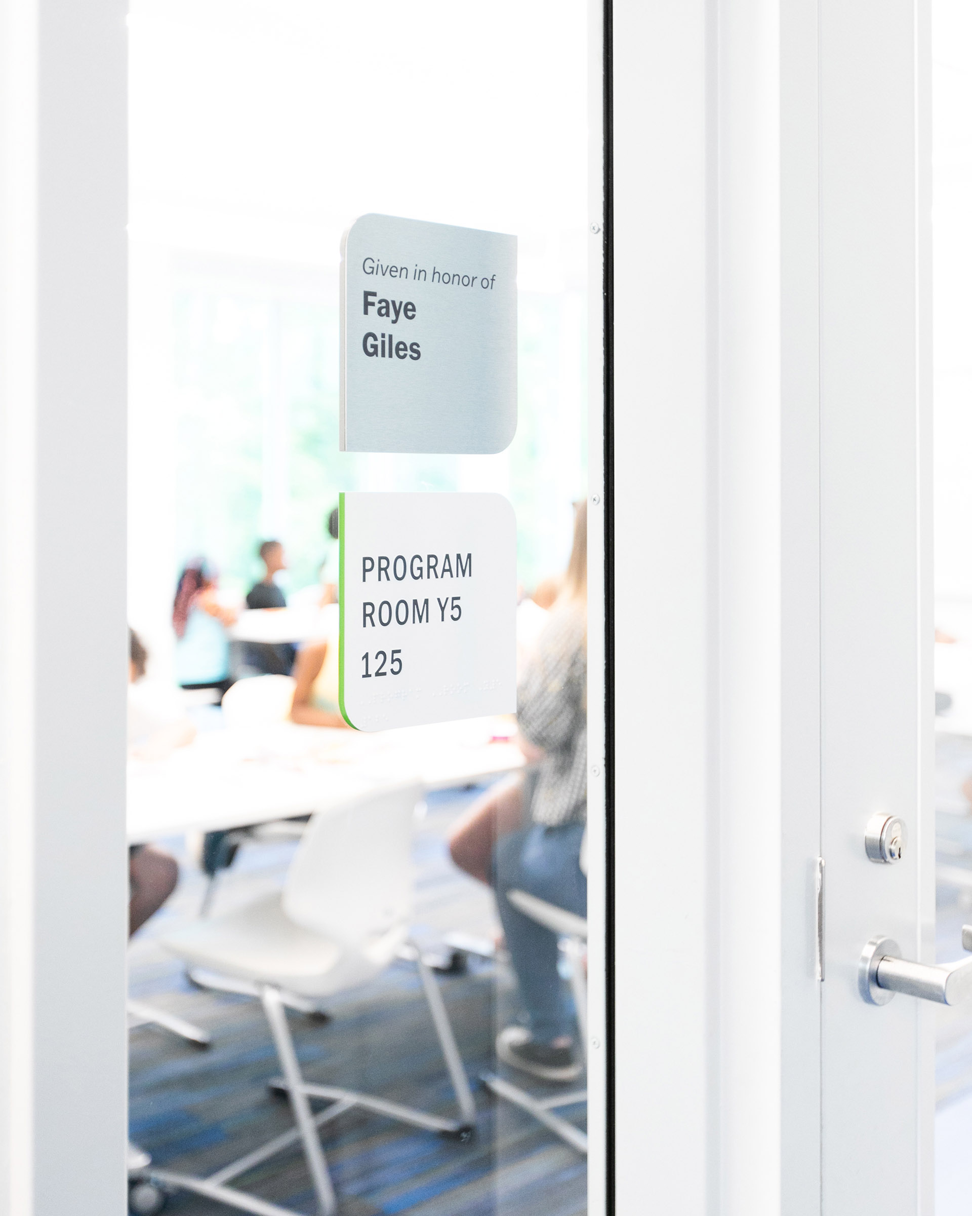 Donor Signage on glass beside a door at the Boys & Girls Club’s Albemarle Campus