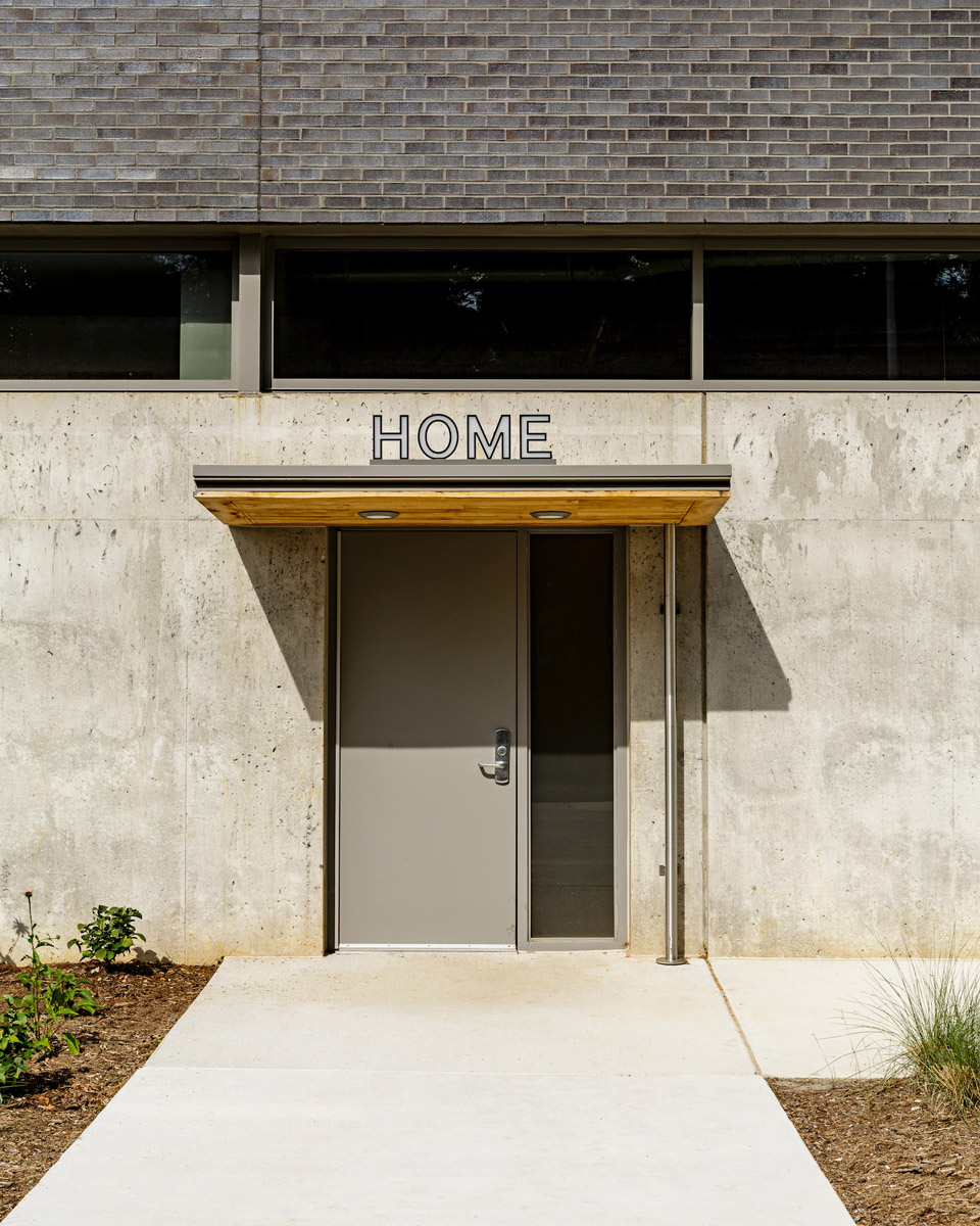 Door at Lynchburg City Stadium with "HOME" signage above it
