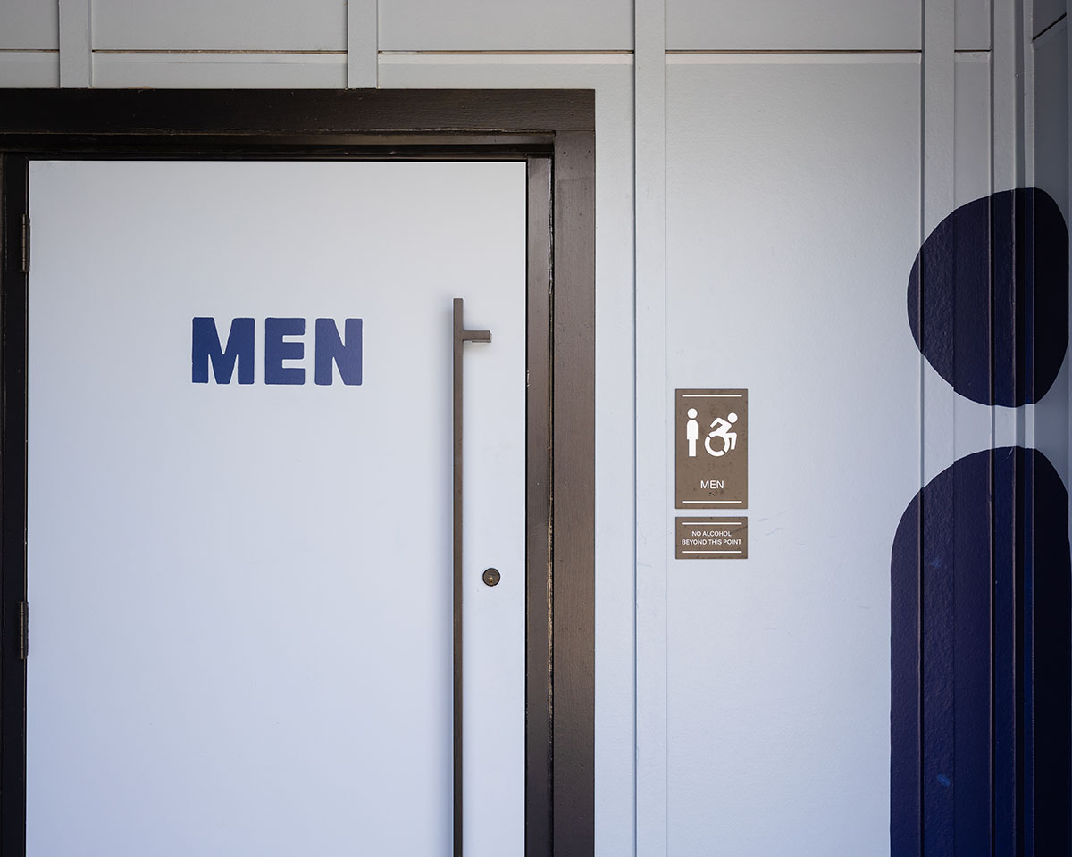 Men's bathroom signage at Allianz Amphitheater
