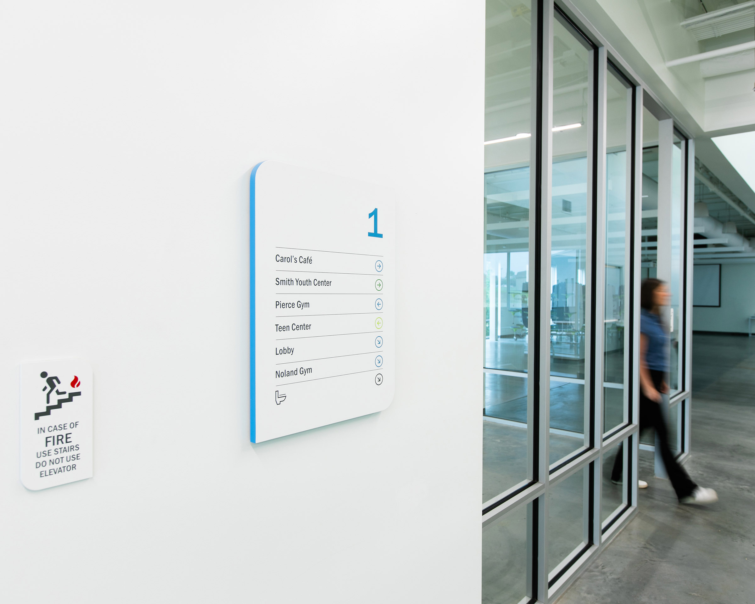 Wayfinding signage on a wall at the Boys & Girls Club’s Albemarle Campus