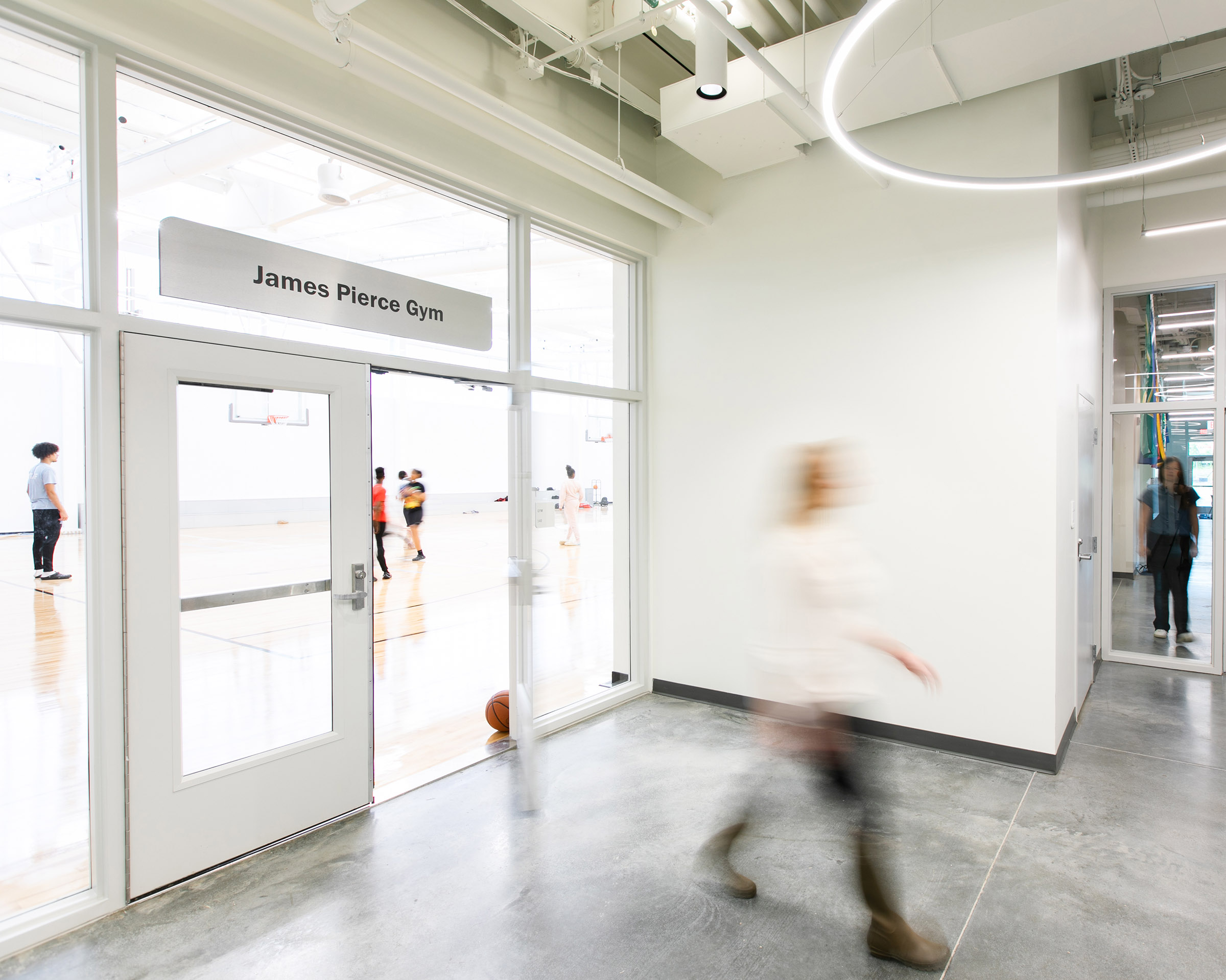 Destination Identification Signage on glass above a door at the Boys & Girls Club’s Albemarle Campus