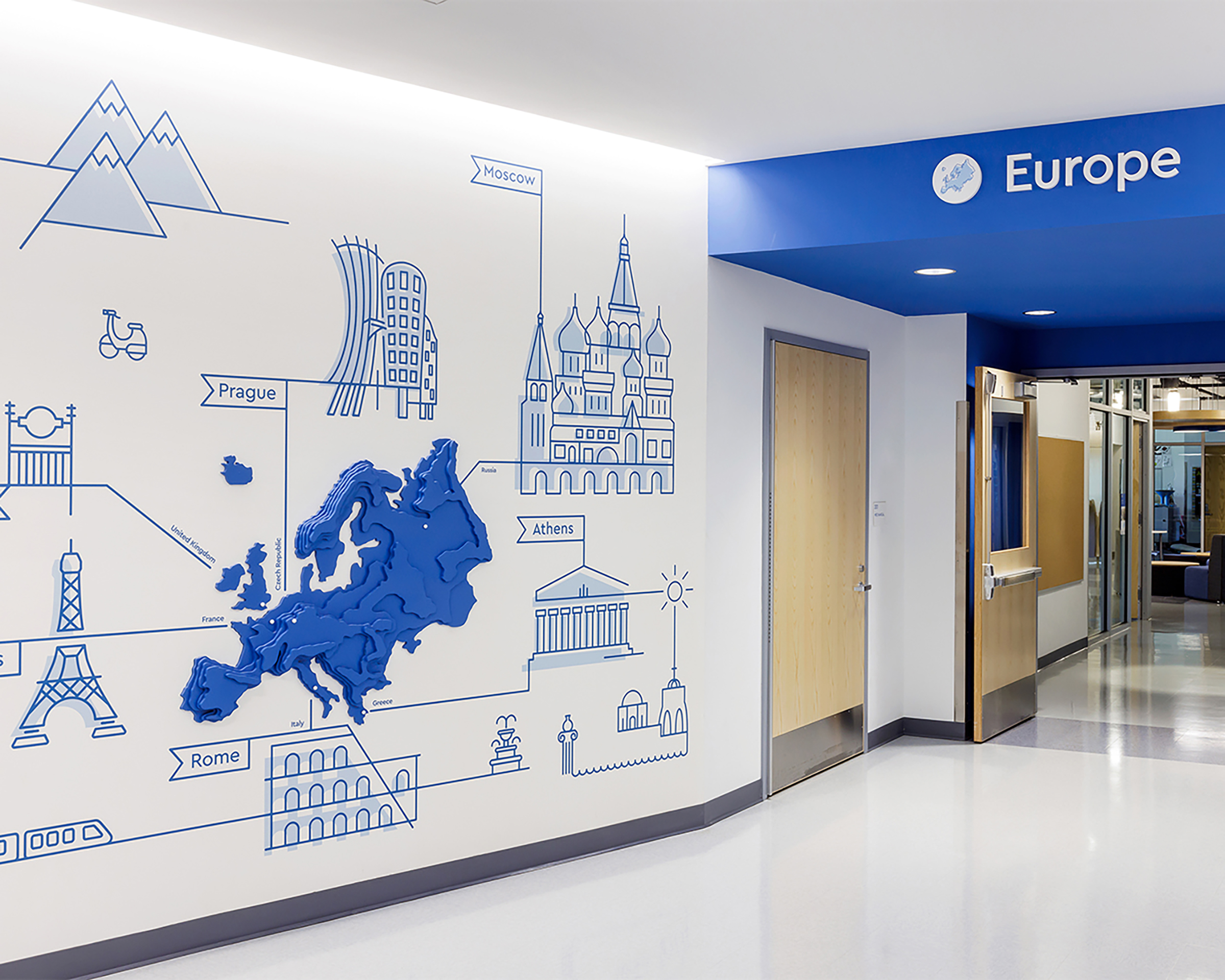 Topographical blue wall graphic of Europe at Cardinal Elementary School.