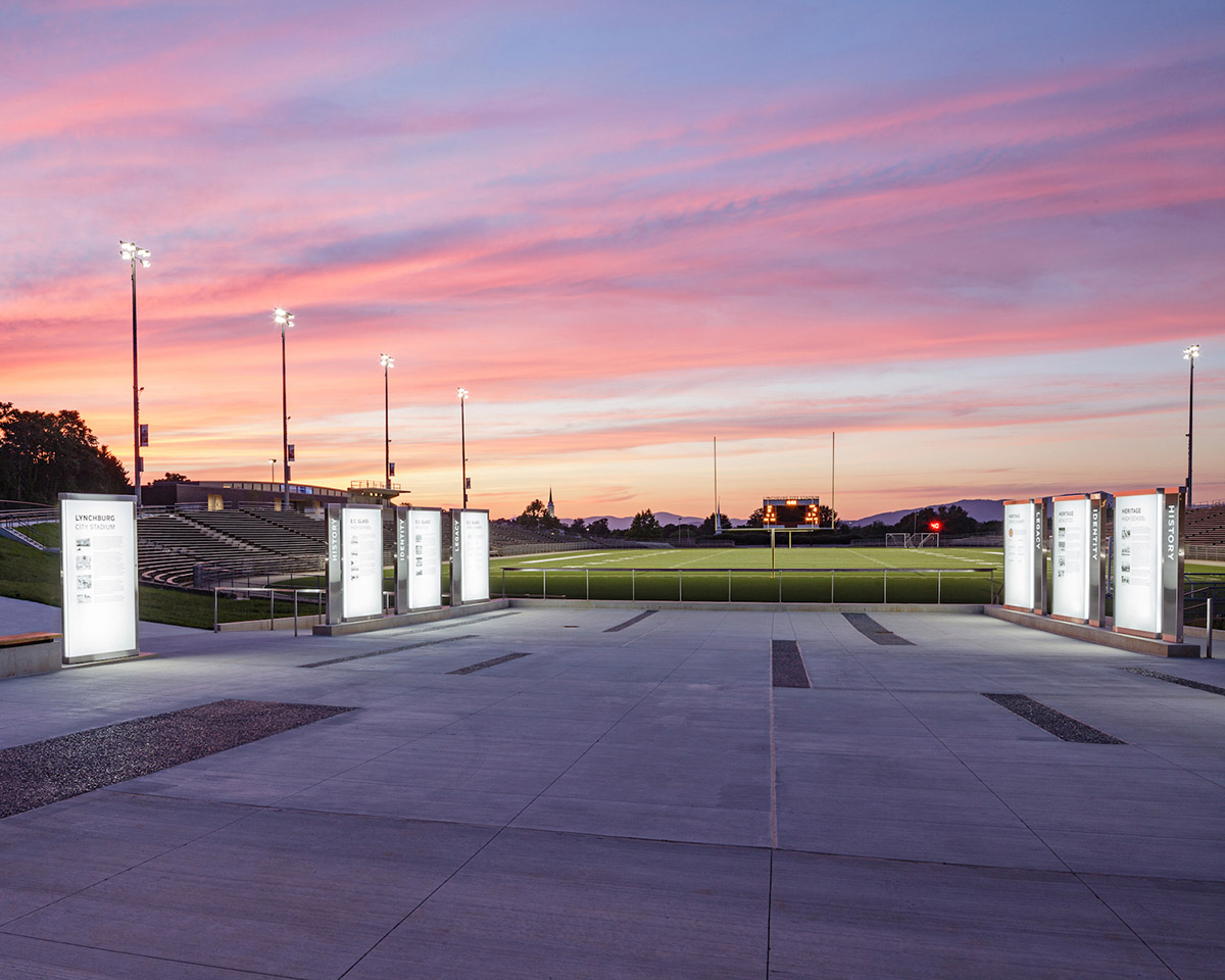 Backlit outdoor glass signage at dusk. Lynchburg City Stadium.