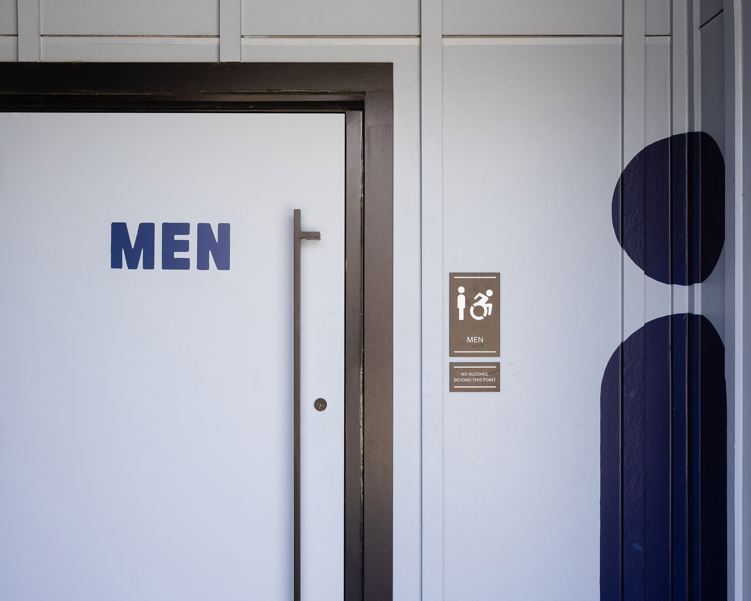 Men's bathroom signage at Allianz Amphitheater